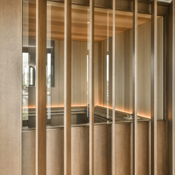 the inside of a room with wood paneled walls and glass partitions on the wall to allow light in